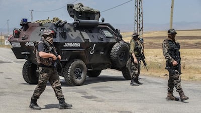 Turkish gendarmes block the road at a military checkpoint in Diyarbakir, south-east Turkey, during 2016 operations against the PKK. AFP / Ilyas Akengin