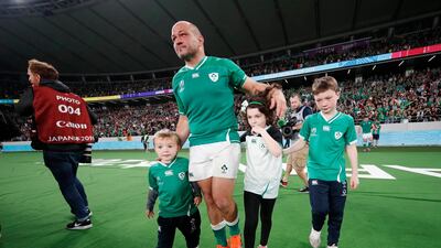 Ireland's Rory Best leaves the pitch with children after the match, Tokyo Stadium, Tokyo, Japan. REUTERS