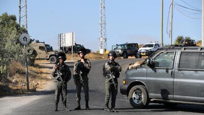 Israeli border policemen stand guard near the scene where the Israeli military said an Israeli soldier was found stabbed to death near a Jewish settlement outside the Palestinian city of Hebron in the Israeli-occupied West Bank August 8, 2019. Reuters