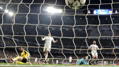 Real Madrid's goalkeeper Keylor Navas, in blue, looks on as Dortmund's Marco Reus' goal hits the net. Javier Soriano / AFP