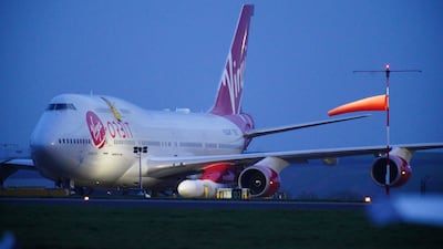A repurposed Virgin Atlantic Boeing 747 aircraft carrying Virgin Orbit's LauncherOne rocket at Cornwall Airport in Newquay, Britain. PA