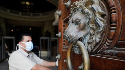 A worker opens doors of the Egyptian Museum at Tahrir Square after its reopening in Cairo, Egypt, on July 1. Reuters