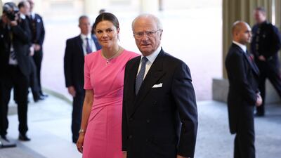 King Carl Gustaf of Sweden and Crown Princess Victoria arrive at the reception. Reuters