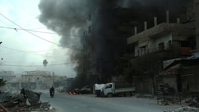 Heavy smoke billows following Syrian government bombardment in the town of Douma in the rebel-held enclave of Eastern Ghouta on the eastern outskirts of the capital Damascus on March 10, 2018. Hamza Al-Ajweh / AFP