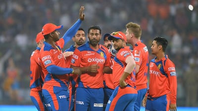 Gujarat Lions’ players celebrate the wicket of Delhi Daredevils’ batsman Sanju Samson during the 2016 Indian Premier League (IPL) T20 cricket match between Delhi Daredevils and Gujarat Lions at The Feroz Shah Kotla Stadium in New Delhion April 27, 2016. AFP / SAJJAD HUSSAIN