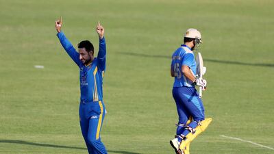 Sharjah, United Arab Emirates - October 17, 2018: Rahmat Shah of the Nangarhar Leopards takes the wicket of Darwish Rasooli of the Balkh Legends during the game between Balkh Legends and Nangarhar Leopards in the Afghanistan Premier League. Wednesday, October 17th, 2018 at Sharjah Cricket Stadium, Sharjah. Chris Whiteoak / The National