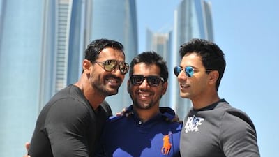 Bollywood actors John Abraham (left) and Varun Dhawan (right) along with Director Rohit Dhawan. Delores Johnson / The National