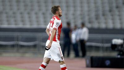 Arsenal's Aaron Ramsey leaves the pitch after receiving his second yellow card in his side's match against Besiktas in the Uefa Champions League on Tuesday. Tolga Bozoglu / EPA