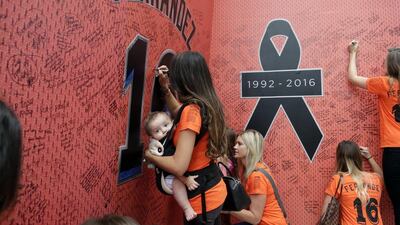 Fans sign a wall at a makeshift memorial for Jose Fernandez. Lynne Sladky / AP