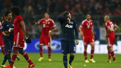 Manchester United striker Wayne Rooney reacts after their Champions League quarter-final loss to Bayern Munich on Wednesday. Michael Dalder / Reuters / April 9, 2014