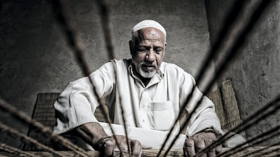 Photo by Ibrahim Salman of carpenter Bou Ahmed at work in a profession that has lasted more than 35 years. Courtesy National Geographic Abu Dhabi