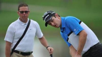 Sean Foley, left, says scheduling his lessons between Justin Rose, right, Tiger Woods and Hunter Mahan requires a little bit of juggling but is not as hard as one might think.