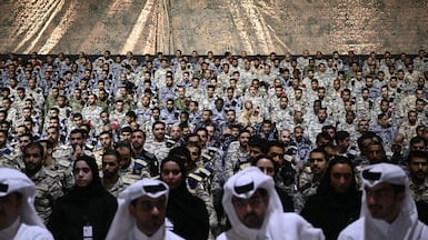 US and Qatari troops at Al Udeid air base south-west of Doha. The Ministry of Defence has opened enlistment to groups previously excluded from Qatar’s national service programme. AFP