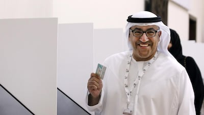 The Minister of Health, Abdul Rahman Al Owais, casts his vote in Sharjah. Jeffrey E Biteng / The National