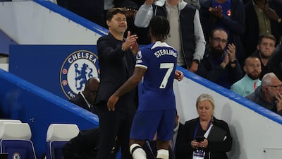 Chelsea's Raheem Sterling with manager Mauricio Pochettino after being subsituted. AP