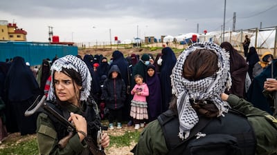 Women fighters stand guard during a joint operation by Syria's Kurdish Internal Security Police Force and the Syrian Democratic Forces, at Camp Roj, Hasakah province. AFP