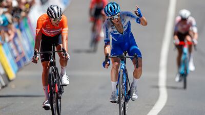 Simon Yates celebrates the stage victory with Jay Vine, the overall winner, at Tour Down Under. EPA
