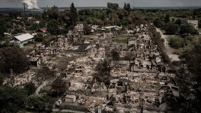 An aerial view shows destroyed houses after strike in the town of Pryvillya at the eastern Ukrainian region of Donbas. AFP