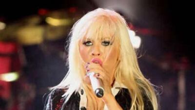 Christina exclaimed about the heat as her customary make-up began to slide from her face.