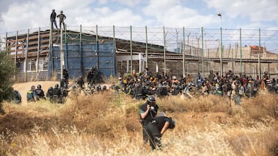 Thirteen migrants died of injuries sustained in the incursion, in addition to five who were confirmed dead earlier in the day.