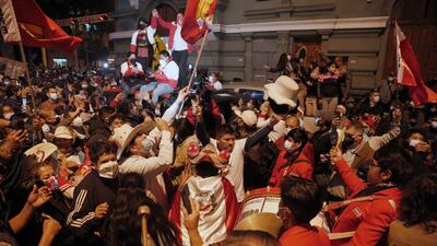 Supporters of Pedro Castillo celebrate after he was declared president-elect of Peru by the election authorities, in Lima.