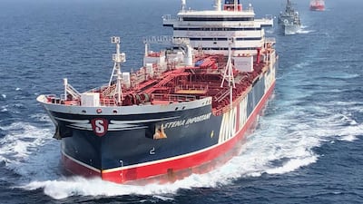 The HMS Montrose, centre, escorts the Stena Important, in front, and the Sea Ploeg through the Arabian Gulf. MOD via AFP Photo