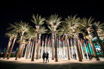 Flag posts at the Dubai's Expo City during Cop28. Reuters