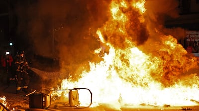 Firefighters try to extinguish a fire in Madrid. AFP