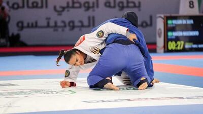 Ishtar Azzawi, in white, competes in the 70kgs blue-belt final at the Abu Dhabi World Professional Jiu-Jitsu Championship 2019.