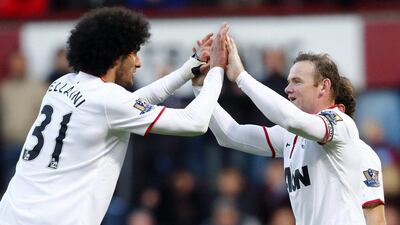 Manchester United are now just two points behind Tottenham for sixth in the Premier League after winning on Saturday. Tal Cohen / EPA / March 22, 2014