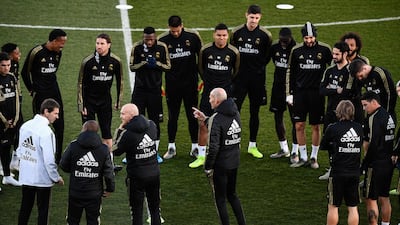Zinedine Zidane, centre, talks to his Real Madrid squad. AFP