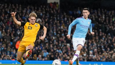 Manchester City's Phil Foden scores his team's fourth goal against Port Vale at the Etihad Stadium. Reuters