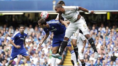 Swansea City defender Ashley Williams, right, jumps with Chelsea's Nemanja Matic during the English Premier League match at Stamford Bridge in London on August 8, 2015. Adrian Dennis / AFP