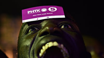 Supporters attend a rally in support of presidential candidate Jovenel Moise of the PHTK Party in the commune of Petion Ville, Port-au-Prince. The next presidential elections will be held on October 25. Hector Retamal / AFP