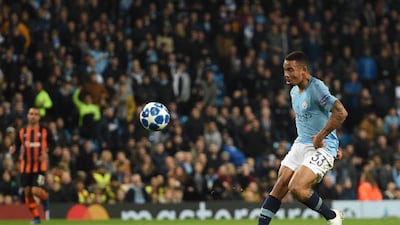 Manchester City's Brazilian striker Gabriel Jesus lobs the keeper to score a hat trick in the 6-0 win over Shakhtar. AFP