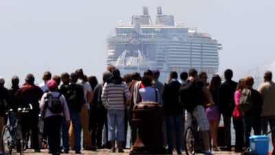 Some 70,000 people watched from along the coast of Saint-Nazaire in France as the Harmony of the Seas pulled away from a shipyard and onward to southern England. Edward Boone / EPA