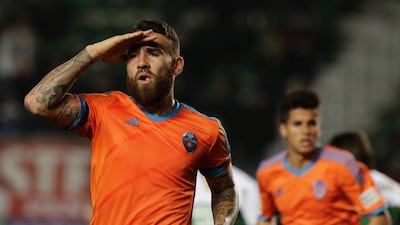 Valencia's Argentinian defender Nicolas Otamendi, left, will not play during the team's Champions League qualifier against Monaco. AFP PHOTO / JOSE JORDAN