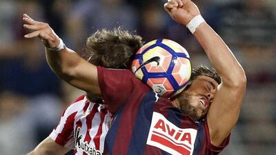 UD Eibar striker Sergi Enrich goes up for a header with Bilbao’s Yeray Alvarez at the Ipurua stadium in Eibar, Basque Country, Spain. Juan Herrero / EPA