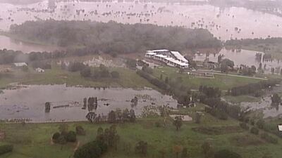 This image from a video shows flooded fields on the Gold Coast, Australia. AP