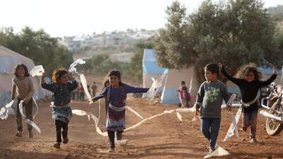 Syrian children play in a camp for internally displaced people near Kah, in the northern Idlib province near the border with Turkey in June 2019. Syria is no longer ranked the least peaceful country in the world, according to the annual World Peace Index. Aaref Watao / AFP