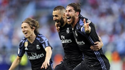Real Madrid’s Karim Benzema, centre, celebrates scoring his side’s second goal in a 2-0 win over Malaga in Malaga, Spain, 21 May 2017. Jorge Zapata / EPA