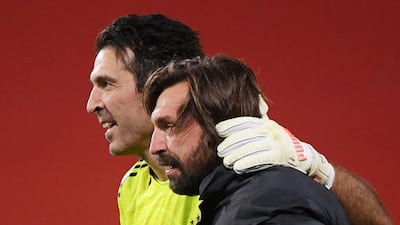 Juventus' Gianluigi Buffon with coach Andrea Pirlo celebrate after winning the Coppa Italia. Reuters