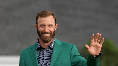 Dustin Johnson of the United States waves during the Green Jacket Ceremony after winning the Masters. AFP