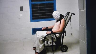 A frame grab from Australian Broadcasting Corporation's Four Corners programme broadcast in Australia on July 25, 2016 which alleged that a teenage boy was hooded and strapped into a chair at a youth detention centre in the Northern Territory city of Darwin. The Australian government ordered an inquiry on July 26 after graphic evidence emerged. AFP / Australian Broadcasting Corp’s Four Corners