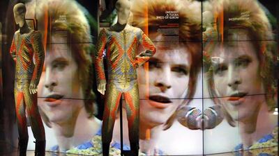 Two suits designed by Freddie Burretti (1972) for the Ziggy Stardust tour, part of David Bowie Is. Charles Platiau / Reuters