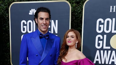 Sacha Baron Cohen, wearing Dolce & Gabbana, and Isla Fisher arrive at the 77th annual Golden Globe Awards at the Beverly Hilton Hotel on January 5, 2020. Reuters