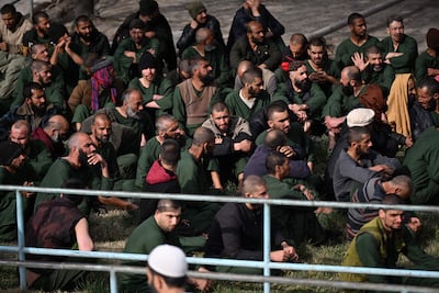 Patients sit outside a drug addiction treatment hospital in Kabul after what Afghanistan said was a Pakistani strike on the facility. AFP