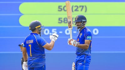 Adeeb Usmani raises his bat after reaching a half century for UAE against Malaysia. Photo: Malaysian Cricket Association