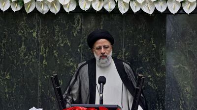 Iran's newly elected President Ebrahim Raisi speaks at his swearing in ceremony at the Iranian parliament in the capital Tehran on August 5, 2021. - Raisi takes the oath before parliament today with Iran facing an economy battered by US sanctions, a grinding health crisis and thorny negotiations on its nuclear programme. (Photo by Atta KENARE / AFP)