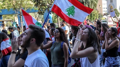 Lebanese students from various universities shout slogans during ongoing anti-government protests as they march from Lebanese University toward Riad Solh square in front the government palace in Beirut. EPA